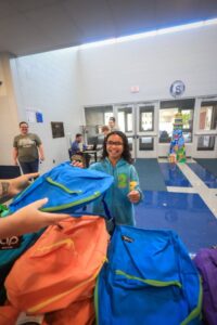 Wisehart Wright Trial Lawyers Donates Hundreds of Backpacks to Local Students