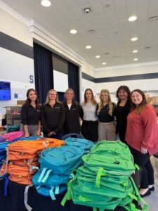 Wisehart Wright Trial Lawyers Donates Hundreds of Backpacks to Local Students